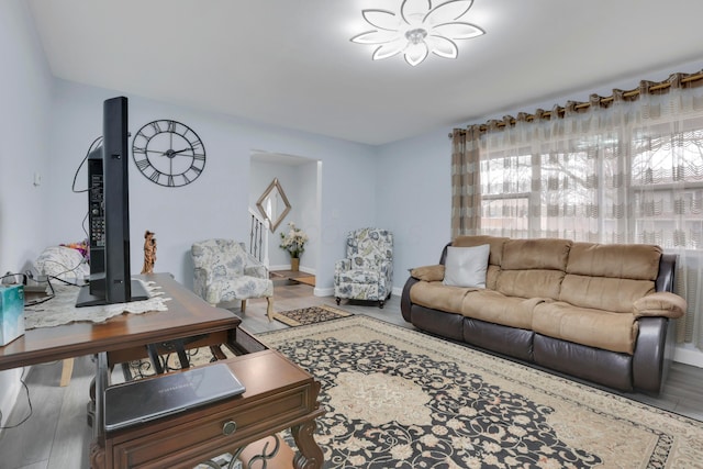 living room featuring wood finished floors and baseboards