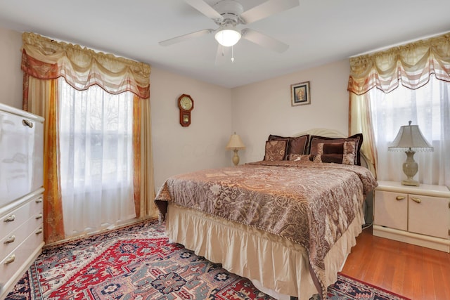 bedroom with ceiling fan and wood finished floors