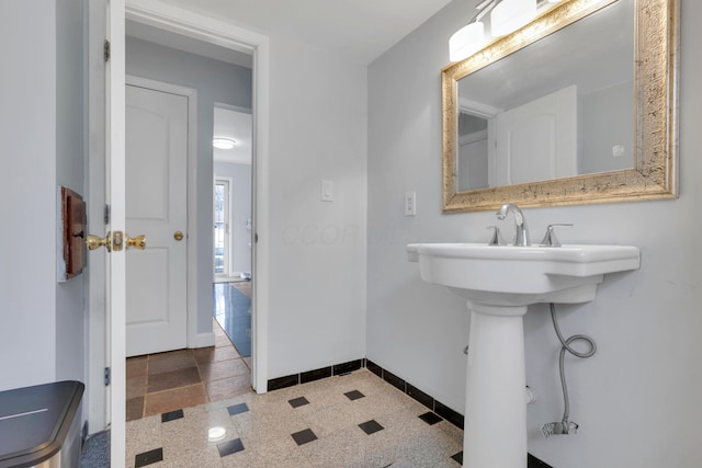 bathroom featuring baseboards