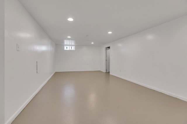 basement featuring recessed lighting and baseboards