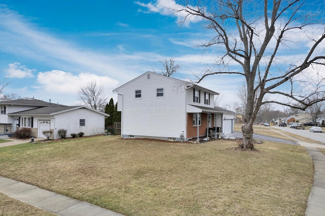 view of side of home with a lawn, concrete driveway, and an attached garage