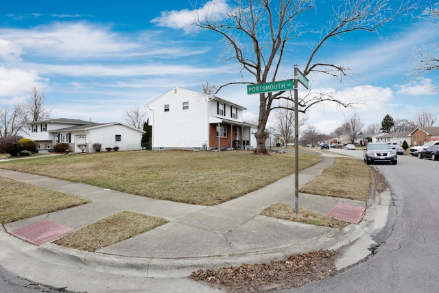 exterior space with sidewalks, a residential view, and curbs