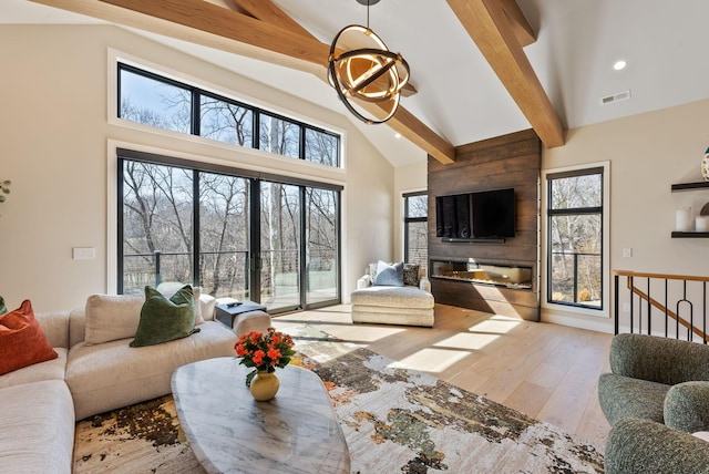 living room featuring visible vents, high vaulted ceiling, beam ceiling, recessed lighting, and wood-type flooring