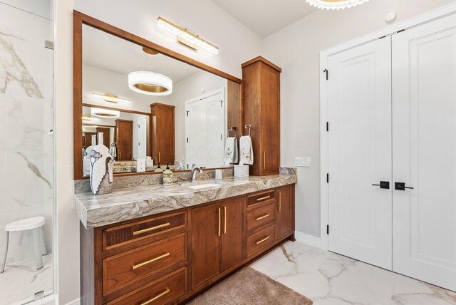 bathroom with vanity and marble finish floor