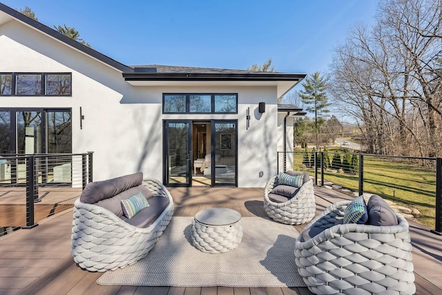 view of patio / terrace with a wooden deck, an outdoor hangout area, and fence