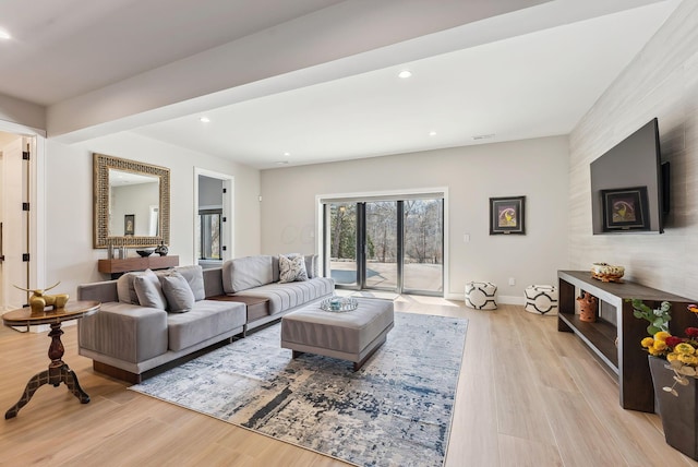 living area with recessed lighting, light wood-type flooring, and baseboards