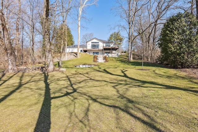 view of yard with a wooden deck