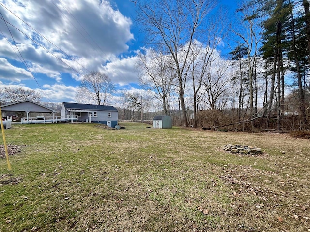 view of yard with an outbuilding and a storage shed