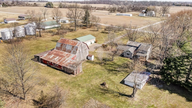 birds eye view of property with a rural view