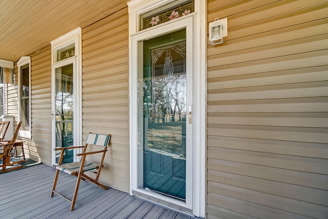 doorway to property featuring covered porch