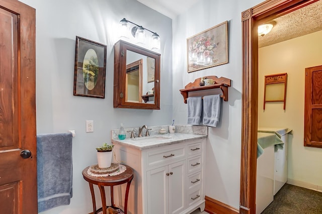 bathroom featuring vanity and baseboards