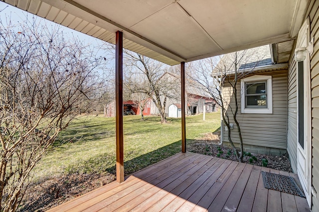 wooden deck with a lawn