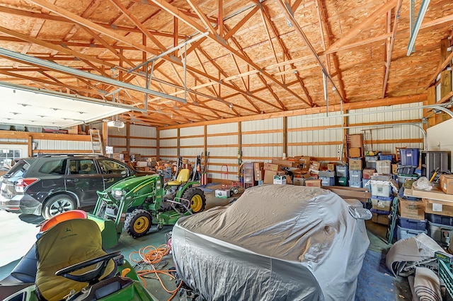 garage featuring metal wall and a garage door opener