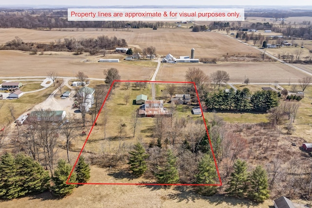 birds eye view of property with a rural view