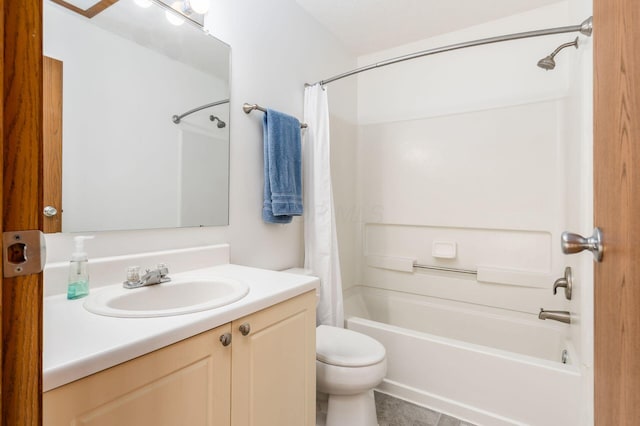 bathroom with vanity, toilet, and shower / bath combo with shower curtain