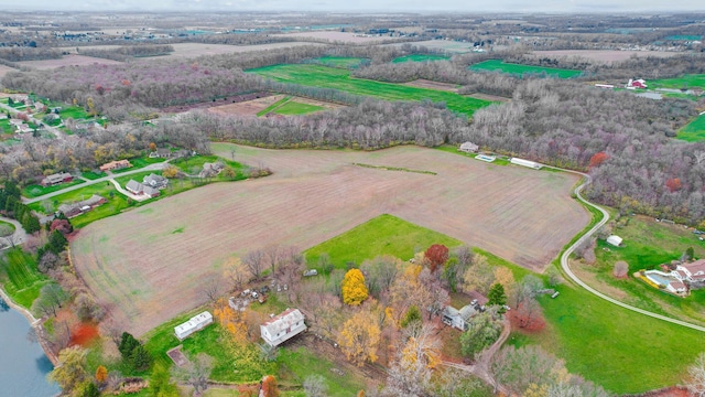 birds eye view of property with a rural view