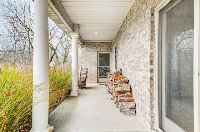 property entrance with brick siding