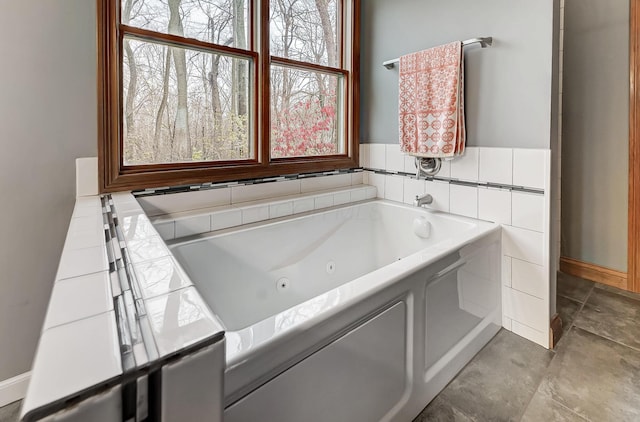 bathroom featuring a whirlpool tub