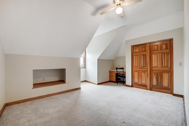 bonus room featuring vaulted ceiling, baseboards, carpet floors, and ceiling fan