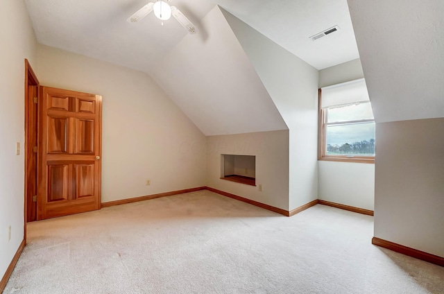 bonus room with lofted ceiling, baseboards, visible vents, and carpet floors