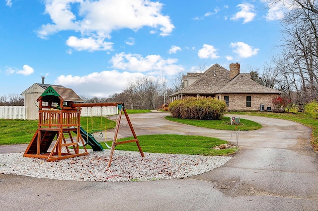 view of playground featuring a lawn