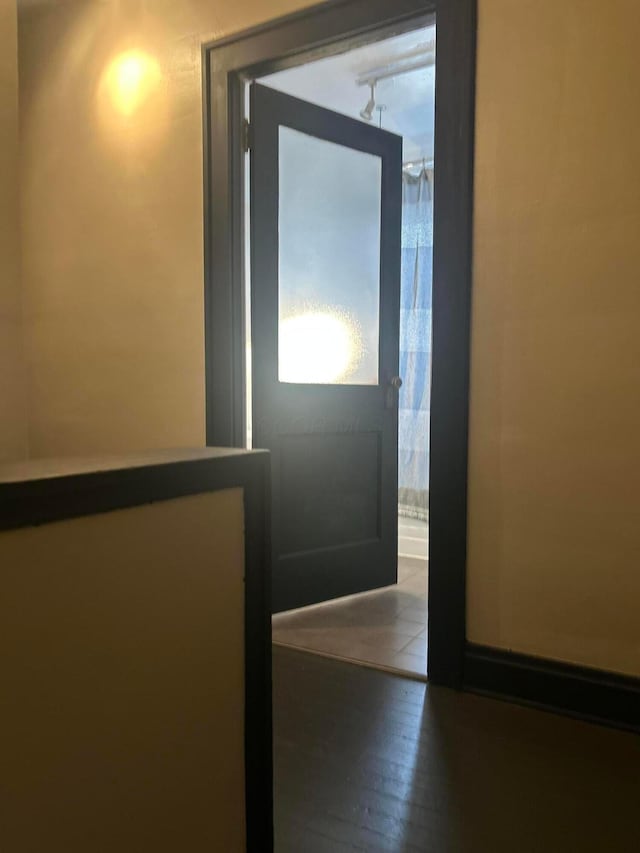 entryway with wood finished floors