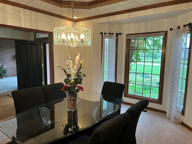 dining room featuring carpet flooring, a chandelier, and a healthy amount of sunlight