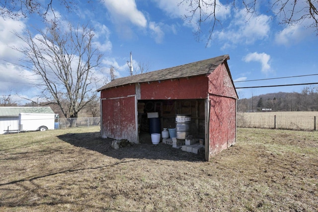 view of outdoor structure with an outdoor structure and fence