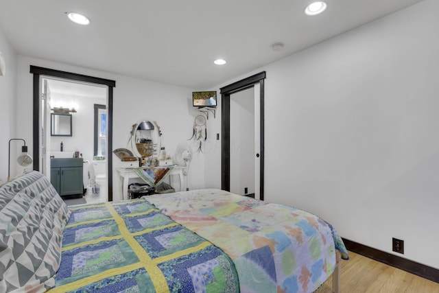 bedroom featuring recessed lighting, baseboards, and wood finished floors