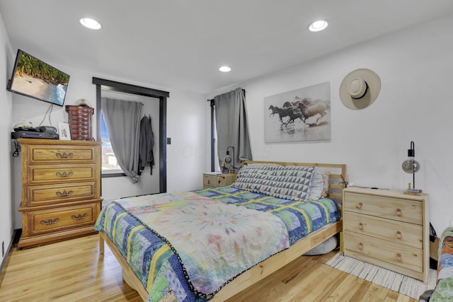 bedroom featuring light wood-style flooring and recessed lighting