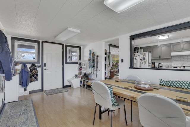 dining area featuring baseboards and wood finished floors