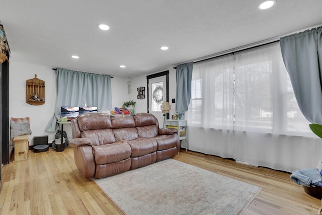 living room featuring recessed lighting and wood finished floors