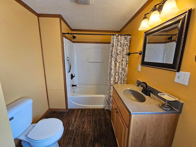 bathroom featuring toilet, vanity, wood finished floors, shower / bath combination with curtain, and a textured ceiling