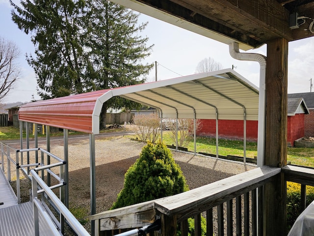 view of car parking with a detached carport and fence