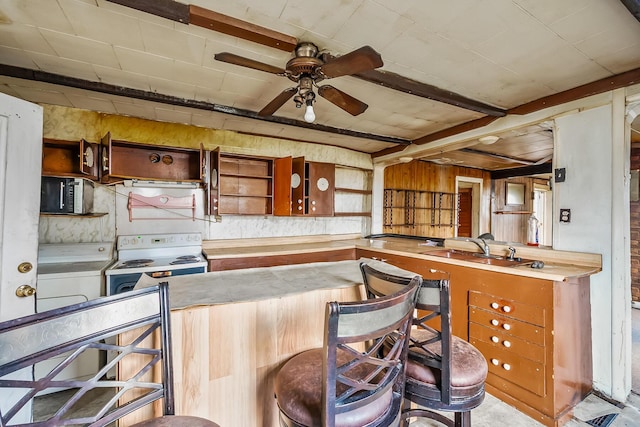 kitchen with open shelves, stainless steel microwave, white electric range oven, and a sink