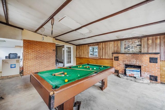 rec room featuring pool table, wooden walls, and concrete flooring