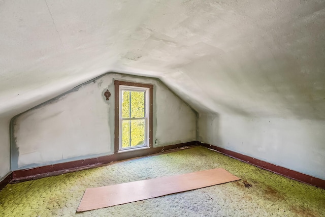 bonus room featuring vaulted ceiling