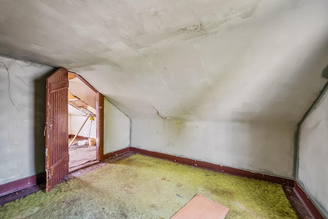 bonus room featuring lofted ceiling