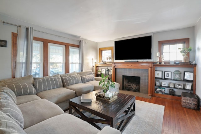 living area featuring a fireplace and wood finished floors