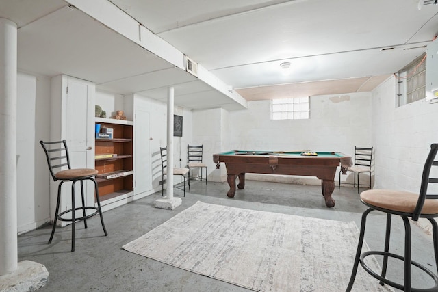 rec room featuring finished concrete floors, concrete block wall, billiards, and visible vents