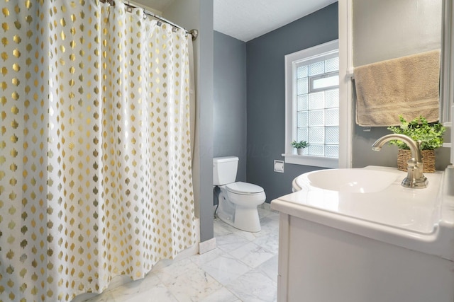 full bathroom with baseboards, toilet, a shower with shower curtain, marble finish floor, and vanity