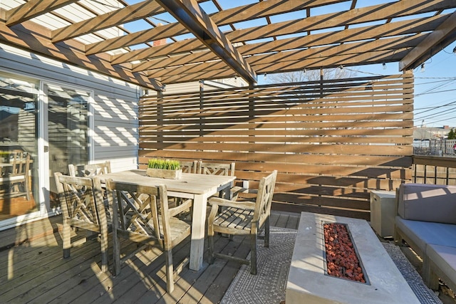 deck with outdoor dining area and a pergola