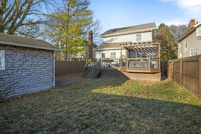 rear view of house with a wooden deck, a yard, a fenced backyard, and a pergola