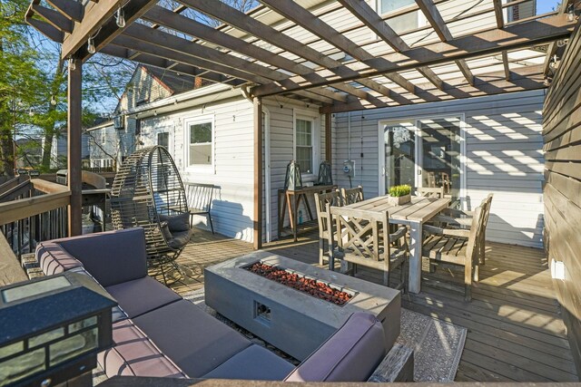 wooden terrace featuring an outdoor living space with a fire pit, outdoor dining space, and a pergola