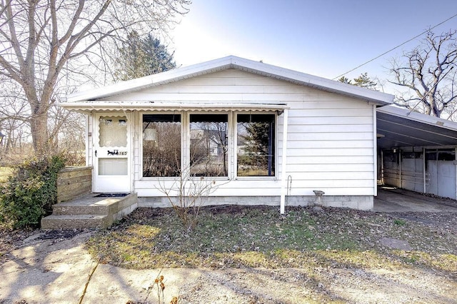 view of front of home featuring an attached carport