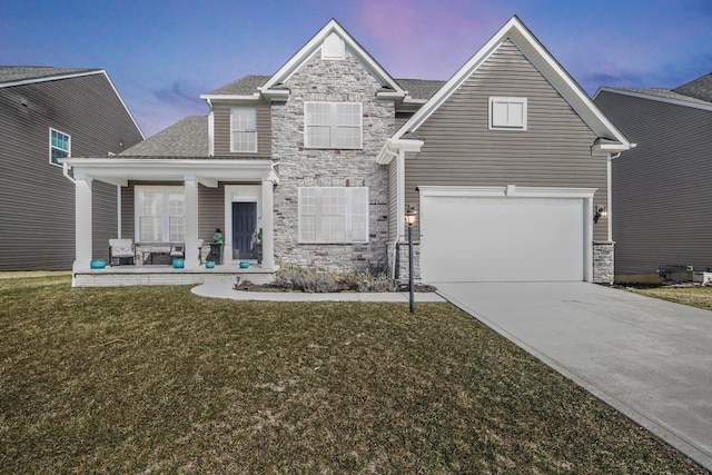 view of front of house with a front lawn, stone siding, covered porch, concrete driveway, and an attached garage