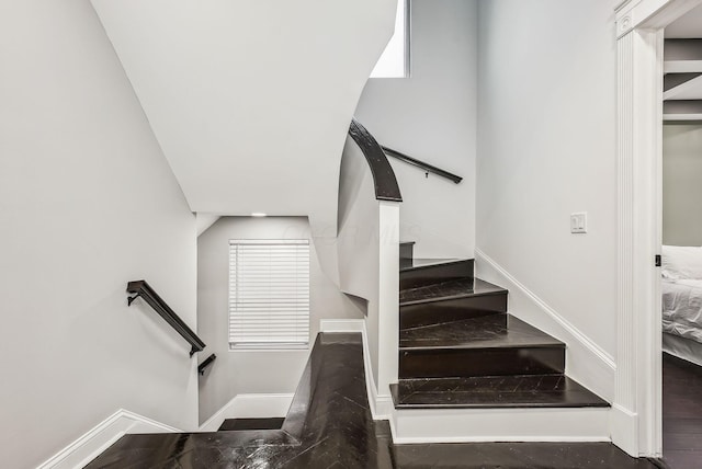 stairway with baseboards