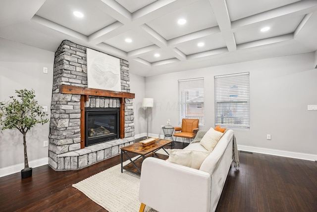 living area with a stone fireplace, coffered ceiling, baseboards, and wood-type flooring