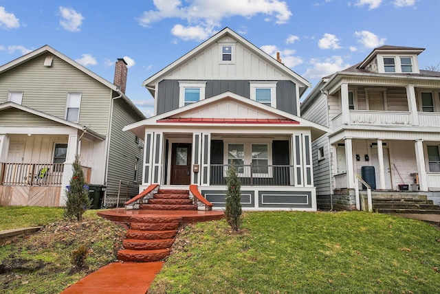 view of front of property featuring covered porch, board and batten siding, and a front lawn