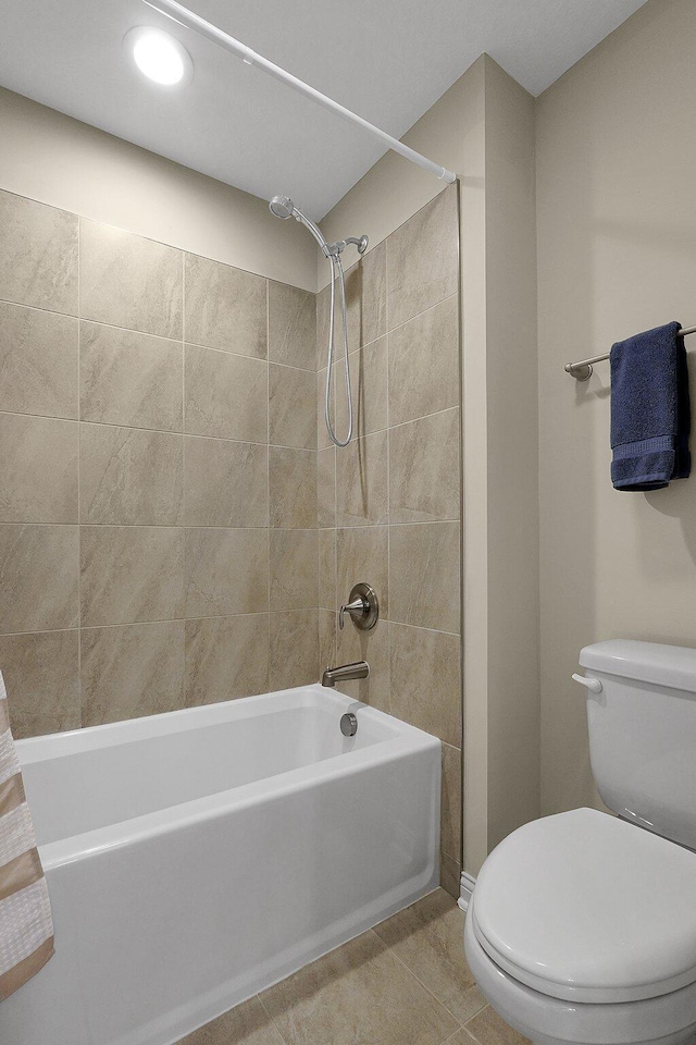 bathroom featuring tile patterned floors, toilet, recessed lighting, and shower / bathtub combination